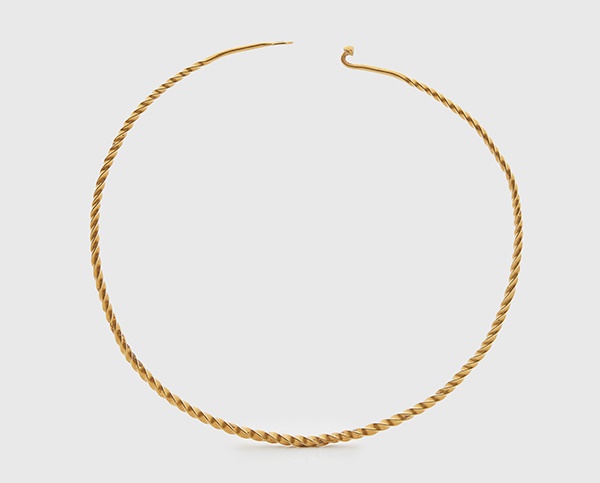 LOT 112 | SUPERB ANCIENT CELTIC GOLD TORC | WESTERN EUROPE, 3RD - 1ST CENTURY B.C. 63.9 grams gold, formed from a single spiral of twisted gold wire, with a fastened pin and hoop terminal 48.5cm circumference | £7,000 - £10,000 + fees